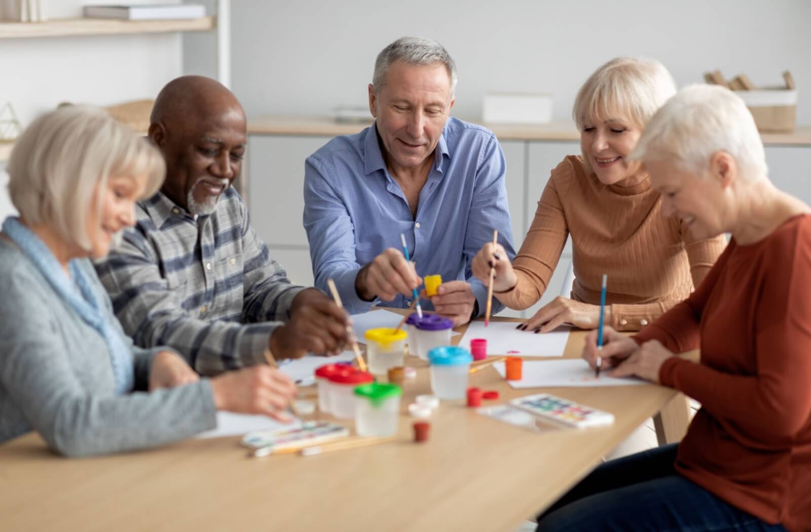 A group of seniors participate in an afternoon of arts and crafts to keep themselves cognitively engaged.